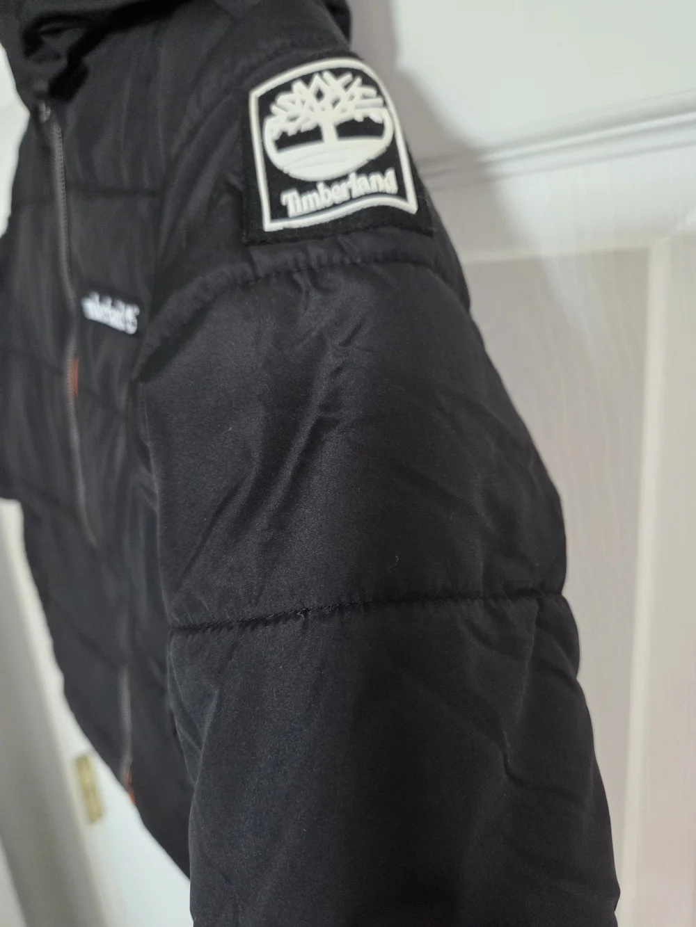 Timberland Kids' Black Puffer Jacket with Orange Lining